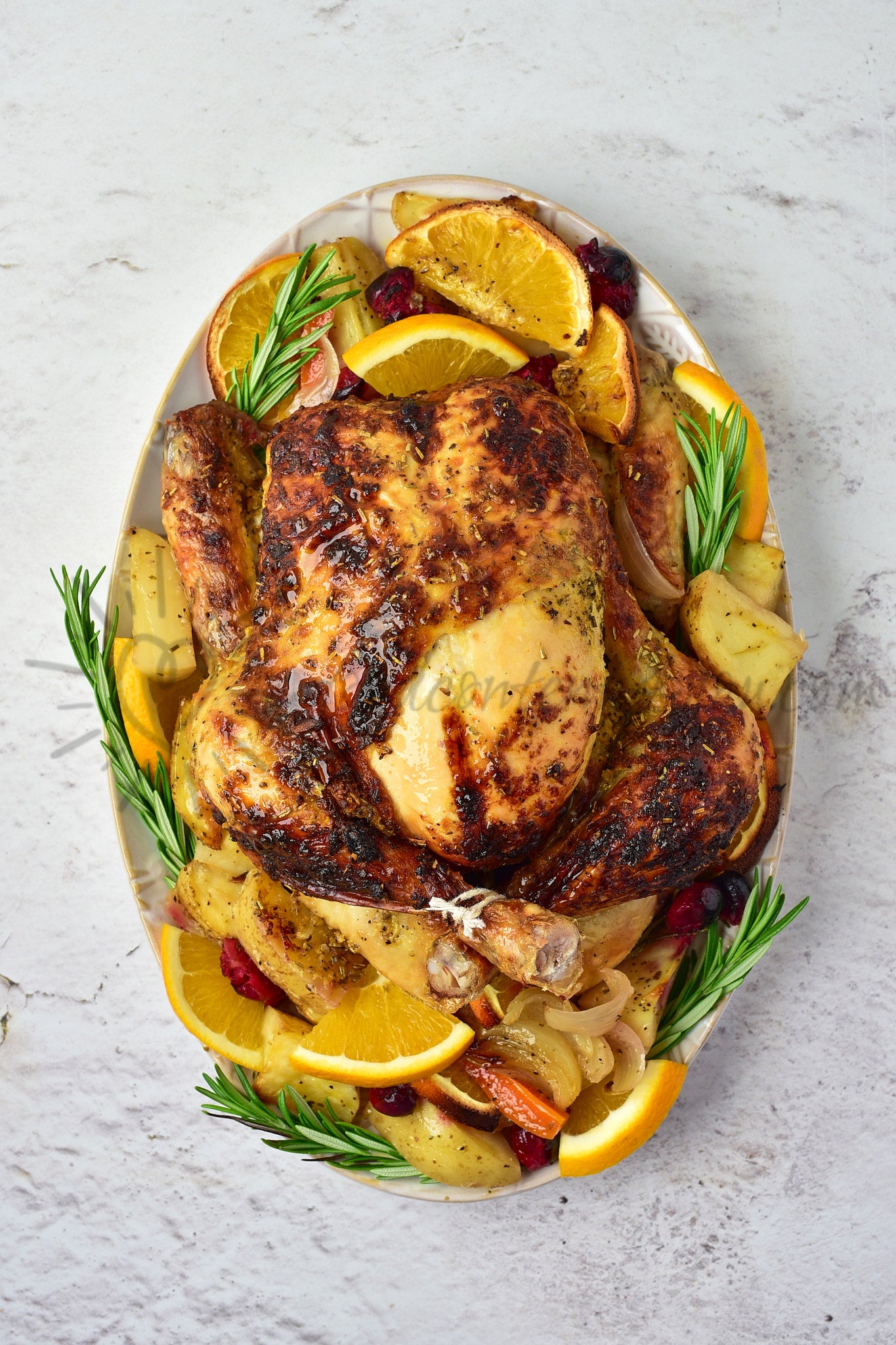 Christmas Roasted Chicken with orange and cranberries
